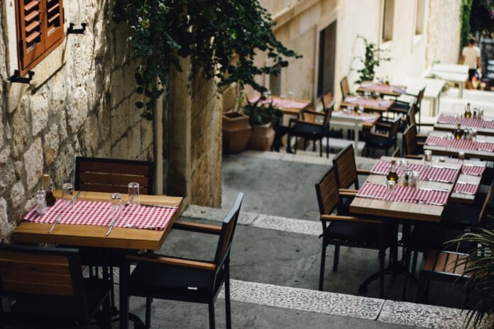 tables and chairs outside the building
